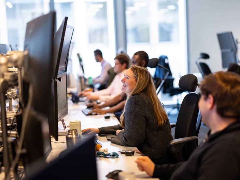 SF Person Smiling At Their Desk 492